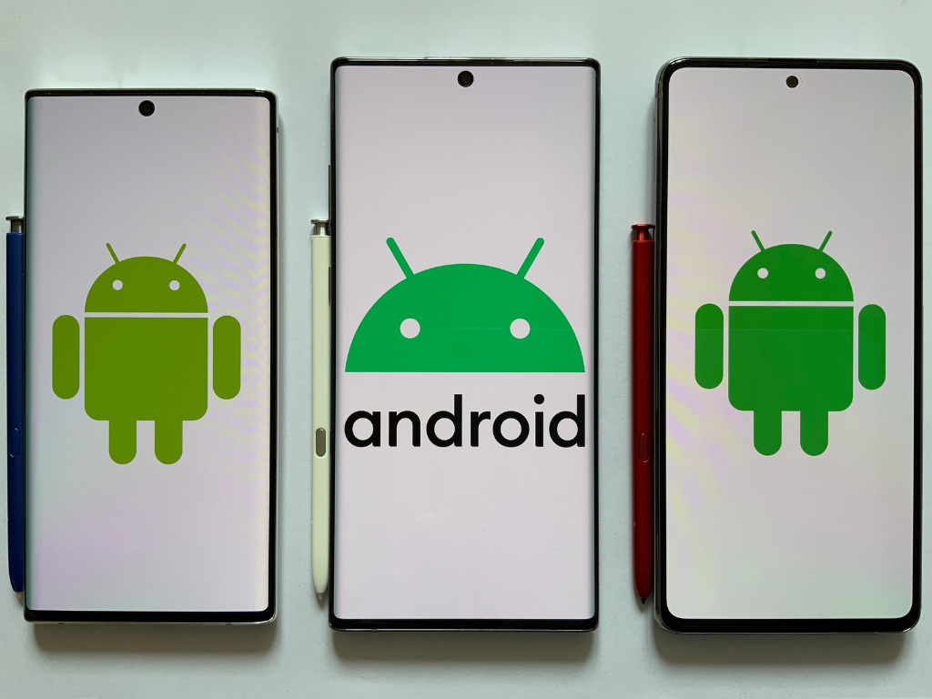 Photo of cell phones with Android logos. Middle image has the word "Android."